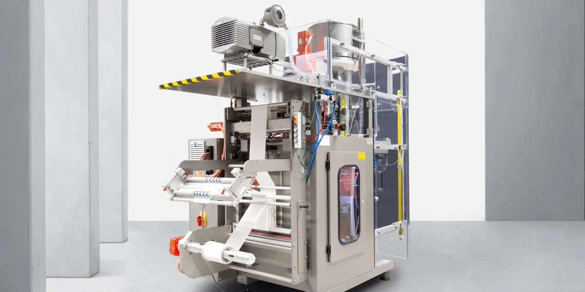 Vertical form fill and seal machine with film roll-off