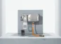 Silver-gray inverter against a gray concrete background with operator panel